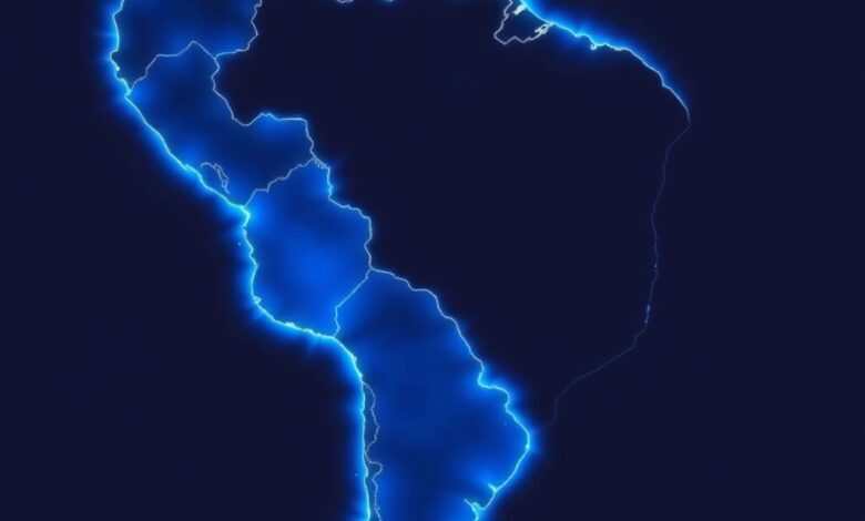 Fotografia de um mapa-múndi iluminado com foco na América Latina e América do Norte em tons azuis.